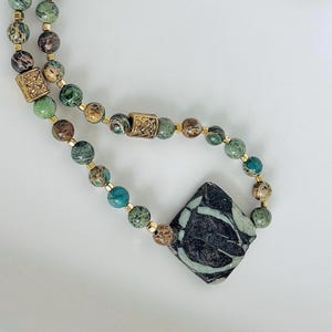 Jasper necklace in green and brown with a pendant.