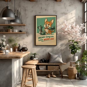 May include: A framed wall art print featuring a cartoon corgi wearing a red bowtie, holding a tray with two cups of coffee, next to a moka pot. The text reads MORE CORG-FEE, LESS WORR-GEE in green and red lettering against a light yellow background.