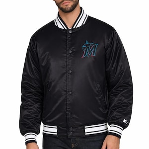 May include: Black satin jacket with white and black striped trim on the collar, cuffs, and waist. Features a button-up front and a team logo on the chest. The jacket has a Starter logo on the left cuff.