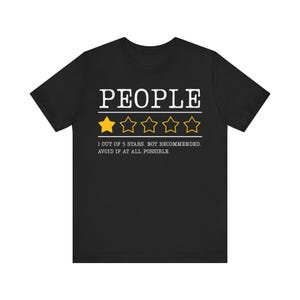 May include: Black t-shirt featuring the word "PEOPLE" in white, above a rating of one gold star out of five. The text below reads "1 OUT OF 5 STARS. NOT RECOMMENDED. AVOID IF AT ALL POSSIBLE."
