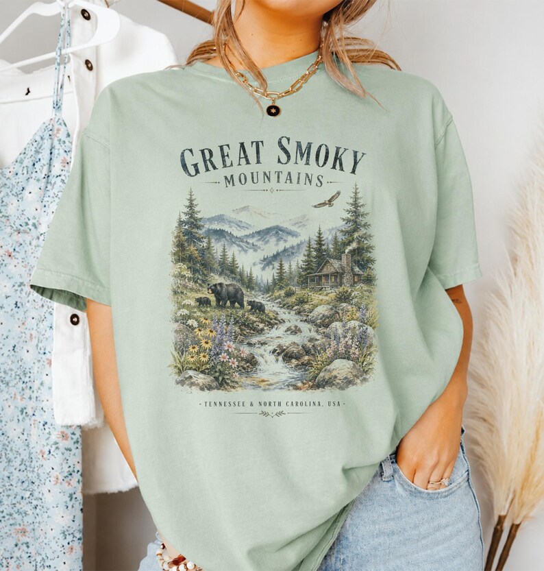 Great Smoky Mountains illustration with bears, cabin, waterfall, and text.