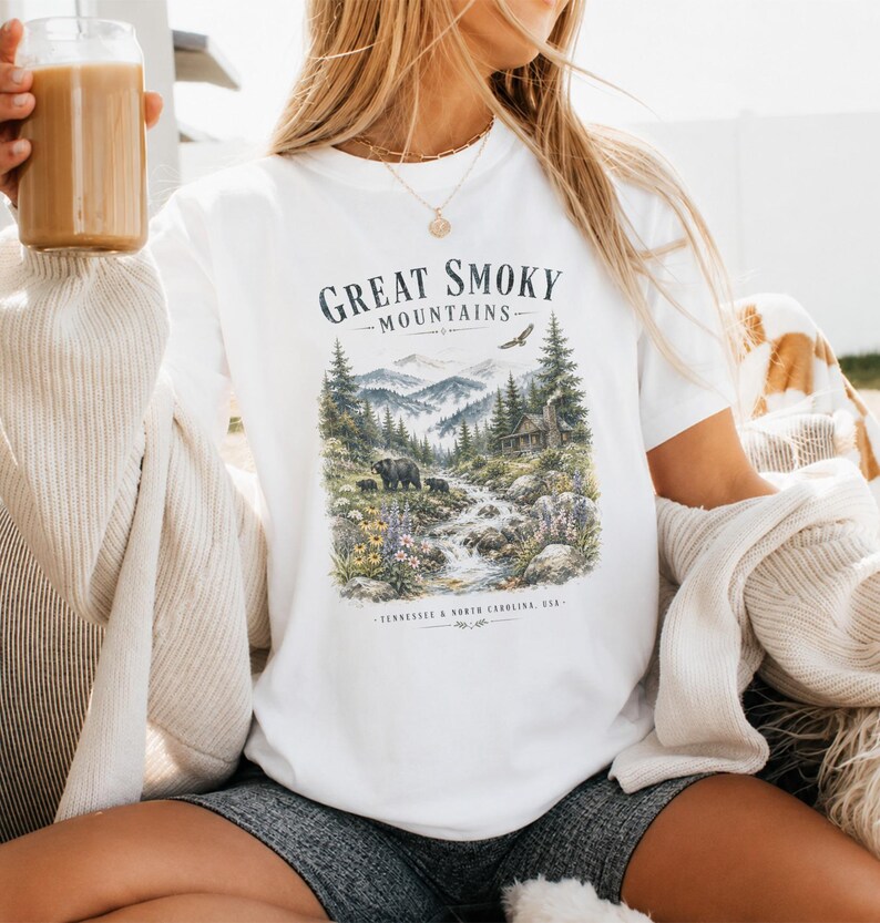 White graphic t-shirt with "Great Smoky Mountains" and wilderness scene.