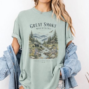 Great Smoky Mountains t-shirt with waterfall, bears, cabin, and text.