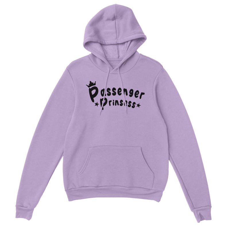 May include: A lilac hoodie with a hood and a front pocket. The hoodie displays the text "Passenger Princess" in black, with a crown above the first word and stars around the second word.