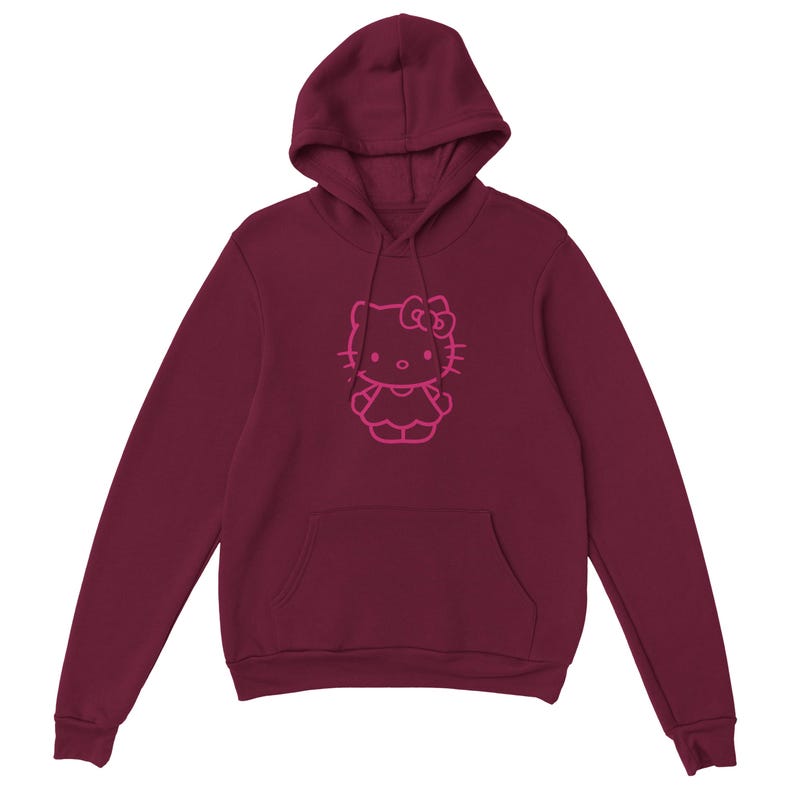 May include: Burgundy hoodie featuring a pink outline of a cartoon cat character. The hooded sweatshirt has a kangaroo pocket and a drawstring. The cat character has a bow and is wearing a dress. The hoodie is made of a soft material.