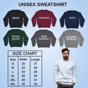 May include: A selection of unisex sweatshirts in black, maroon, navy, forest green, dark heather, and graphite heather. A size chart is included, with measurements in inches. A person is wearing a white sweatshirt.