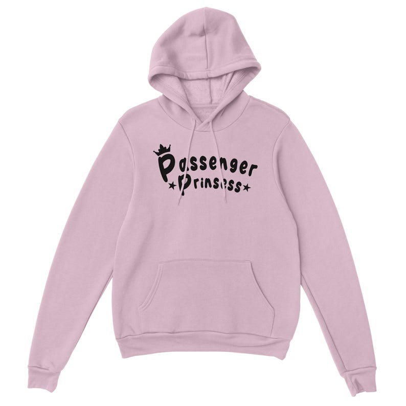 May include: A pale pink hoodie with a hood and a front pocket. The black text on the front says "Passenger Princess" with a crown and stars. The hoodie is made of a soft material.