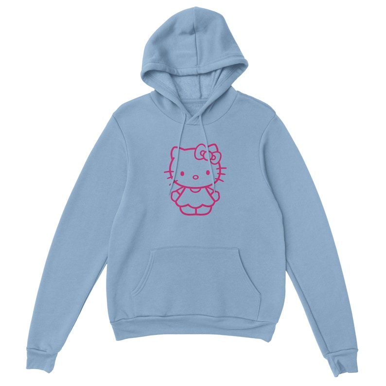 May include: A light blue hoodie featuring a pink outline of a cartoon cat character. The hoodie has a drawstring hood and a kangaroo pocket. The cat character has a bow and is centered on the front of the garment.