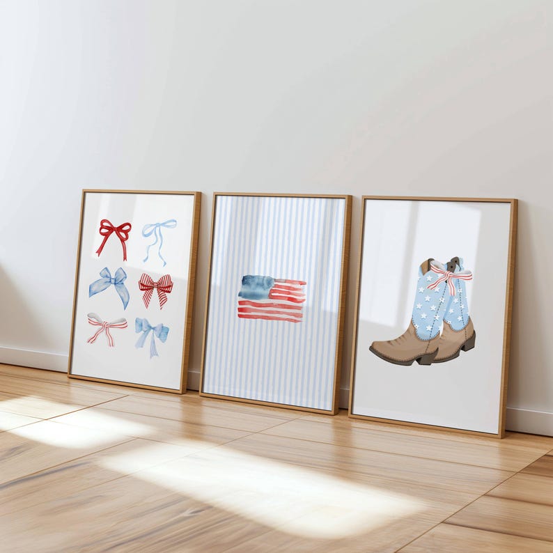May include: Three framed watercolor prints. The first features red, blue, and pink bows. The second depicts a watercolor American flag. The third shows a brown cowboy boot with a blue star-patterned shaft.