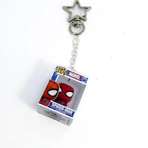 spiderman keychain,superhero character,funko charm,comic book style accessories,gift for spiderman fans,bag keychain charm