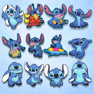 May include: A collection of blue and white Stitch character charms in various poses. Some charms feature Stitch with a ukulele, a lei, or on a surfboard. The charms are made of a rubbery material and are likely shoe charms or decorative accessories.