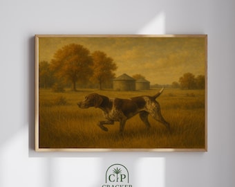 May include: A framed print depicting a hunting dog in a field. The dog is brown and white, with a focused expression. The background features trees, a barn, and a golden sky. The print is labeled "Cracker Prints".