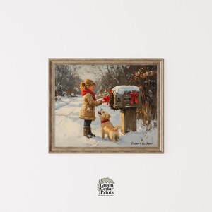 May include: Framed print of a winter scene with a young girl and a dog by a mailbox decorated with red bows. The girl wears a tan coat and red scarf. The dog has a red collar. Snow covers the ground and mailbox.