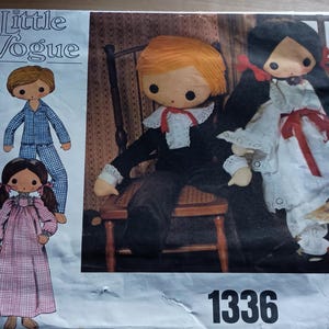 May include: Vintage "Little Vogue" sewing pattern featuring illustrations of rag dolls. The cover shows a boy doll in pajamas, a girl doll in a nightgown, and two larger dolls dressed in formal attire. The pattern number "1336" is visible.