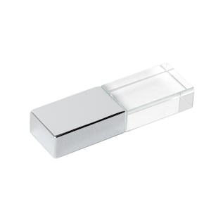 May include: A silver and clear crystal USB flash drive. The drive has a rectangular shape and a sleek, modern design.