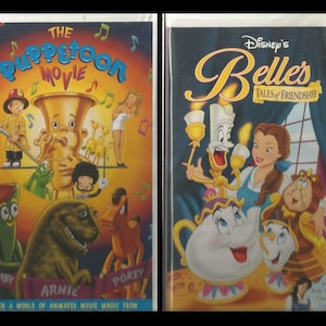 May include: Two VHS tapes, one with a colorful cartoon image of a musical instrument and characters, titled "The Puppetoon Movie", and the other with a cartoon image of Belle from Disney's Beauty and the Beast, titled "Disney's Belle's Tales of Friendship".