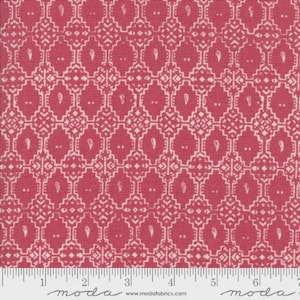May include: Close-up of a fabric with a repeating pattern. The fabric is a deep pink color with a white geometric design. The design includes diamond shapes, paisley-like elements, and small dots. The fabric is measured in inches.