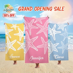 May include: Three beach towels in yellow, pink, and light blue, each featuring a white starfish design. The towels are held up on a sandy beach. The text "GRAND OPENING SALE" and "58% OFF" are visible.