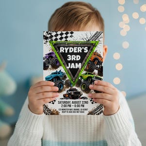 May include: A rectangular party invitation card featuring a green triangular frame with the text RYDER'S 3RD JAM. The design includes four colorful monster trucks, black and white checkered patterns, and tire tracks. Event details are printed below.