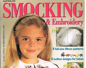 May include: A magazine cover for "Smocking & Embroidery" featuring a young girl wearing a green smocked dress with a white embroidered collar. The cover also includes a free pattern for a baby dress, 4 full-size liftout patterns, 6 bullion designs for babies, and 14 smocking designs for all ages.
