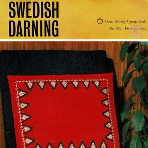 May include: A red rectangular pillow with a detailed embroidered border featuring a repeating triangular pattern in black, white, and gold. The pillow is on a dark green chair. The image also includes the text "SWEDISH DARNING".