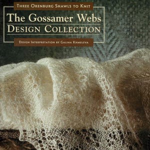 May include: A book cover displaying the title "The Gossamer Webs Design Collection" with the text "Three Orenburg Shawls to Knit." The image shows a close-up of a cream-coloured, lacy shawl. The design interpretation is by Galina Khmeleva.