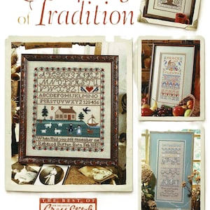 May include: A collection of framed cross-stitch samplers. The main sampler displays an alphabet and a rural scene. Other samplers feature diverse designs, including a house, birds, and text. The text "A Sampling of Tradition" is at the top, with "The Best of Cross Stitch" at the bottom.