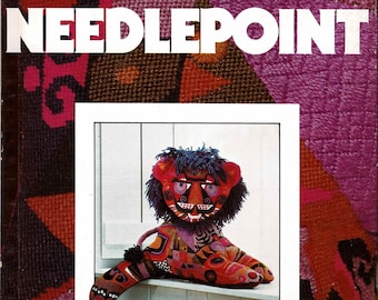 May include: A colourful needlepoint lion rug with a blue mane and a red, white and blue face. The rug is sitting on a white windowsill. The text "35 exciting projects you can make Rugs, pillows, holiday decorations Quickpoint, bargello, and petit point" is printed below the rug.