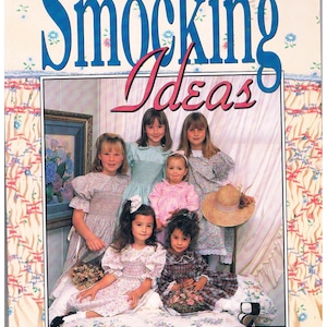 May include: A book titled "Smocking Ideas" by Fiona J. Roediger, featuring a group of young girls wearing smocked dresses. The girls are sitting on a bed with a floral pattern.