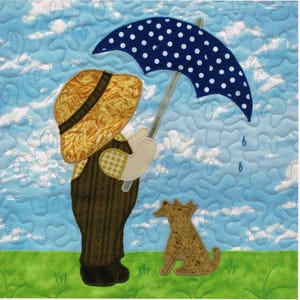 May include: A quilted artwork depicts a child and dog in the rain. The child, wearing a straw hat and overalls, holds a blue polka-dot umbrella. The dog sits on green grass under a cloudy blue sky. Raindrops are falling.