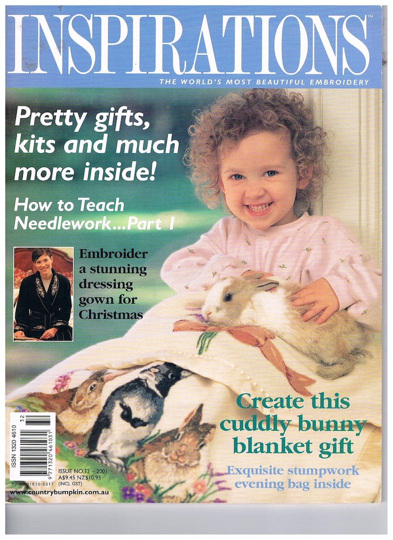May include: A magazine cover featuring a young girl holding a white and brown bunny rabbit. The magazine is titled "Inspirations: The World's Most Beautiful Embroidery". The cover also features a headline that reads "Pretty gifts, kits and much more inside!" and a sub-headline that reads "How to Teach Needlework... Part I".