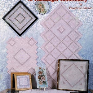 May include: The cover of a book, "Elegant Variations in Hardanger Embroidery", displays examples of Hardanger embroidery. The samples are in pink and white, with geometric and floral patterns. A small plate with a floral design is also visible.