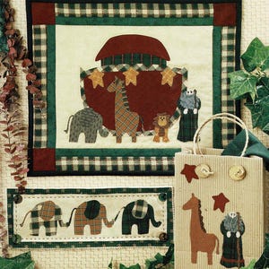 May include: A quilt pattern book titled "Rainy Day Friends" featuring a patchwork quilt design with a red, green, and white plaid pattern. The quilt depicts a Noah's Ark with animals, including a giraffe, elephant, and lion. The book also includes a smaller quilt pattern for a tote bag with a giraffe, elephant, and a man in a robe.