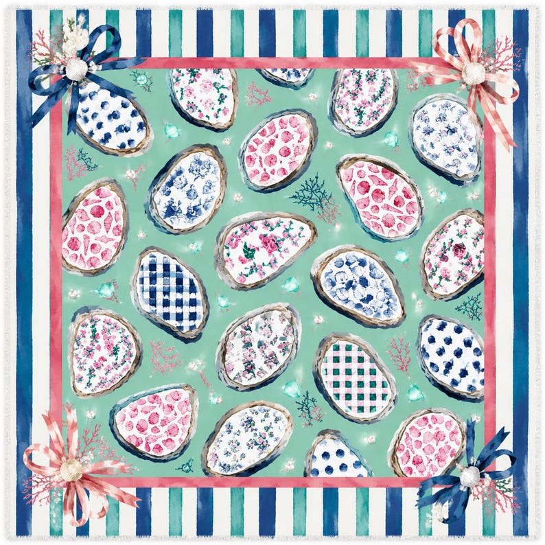 May include: A square throw blanket featuring a repeating pattern of oyster shells filled with various floral, gingham, and polka dot prints on a mint green background. The border has blue and teal stripes with bows at each corner.