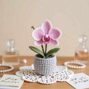 May include: A set of three ceramic mugs with a speckled, matte finish. The mugs are in shades of cream, light grey, and dark grey. Each mug has a simple, minimalist design and a rounded handle.