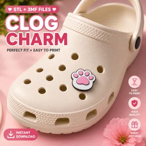 May include: A cream-colored clog shoe featuring a small, white and pink paw print charm inserted into one of the ventilation holes. The image includes text reading STL + 3MF FILES, CLOG CHARM, PERFECT FIT, EASY TO PRINT, and INSTANT DOWNLOAD.