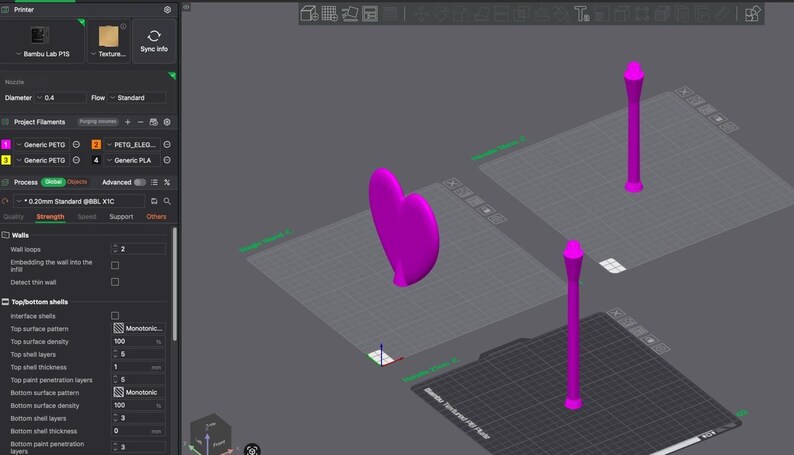 May include: A computer screen displays a 3D modeling software interface. The scene features a magenta heart shape and two magenta, stylized columns. The software interface includes various settings and options for 3D printing.