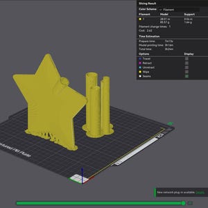 May include: A digital 3D model of a yellow star-shaped object with a cylindrical attachment and three vertical pillars on a grid platform. The interface displays slicing results, including a total filament usage of 28.55 metres and 87.20 grams.