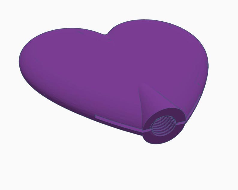 May include: A solid purple heart-shaped object with a threaded opening. The heart is smooth and three-dimensional, with a slightly angled perspective. The opening has a circular shape with internal grooves.
