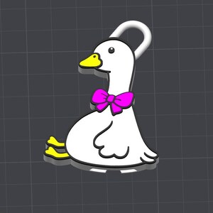 May include: A white goose charm with a yellow beak and feet, featuring a bright pink bow tie around its neck. The goose is depicted in a sitting position with a small white loop at the top for attachment, outlined in black against a dark grid.