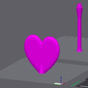 May include: A vibrant magenta heart shape and a tall, slender magenta object with a threaded top are displayed on a gray surface. The heart is smooth and three-dimensional, while the other object has a cylindrical base and a tapered design.