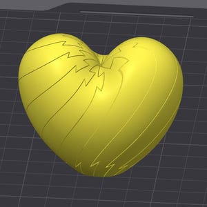 May include: A bright yellow, heart-shaped 3D model featuring a series of engraved lightning bolt patterns that curve along the surface. The object is displayed against a dark gray grid background, highlighting its smooth, rounded form and symmetry.
