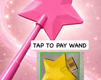 May include: A pink star-shaped wand with the text "TAP TO PAY WAND". The wand has a handle and a star-shaped head. A yellow star-shaped object with a credit card is also shown.