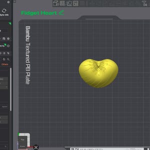 May include: A digital interface for a 3D printer showing a yellow heart-shaped object on a grid labeled Bambu Textured PEI Plate. The software sidebar displays printer settings, including a 0.4 mm nozzle diameter and generic PETG filament.