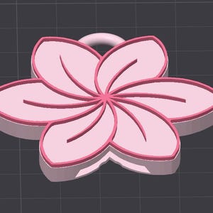 May include: A 3D-rendered pink flower pendant with a loop for hanging. The flower has six petals with darker pink outlines and interior lines. The pendant is set against a dark gray background.