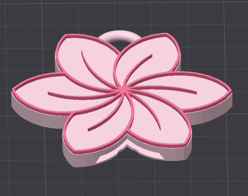 May include: A 3D-rendered pink flower pendant with a loop for hanging. The flower has six petals with darker pink outlines and interior lines. The pendant is set against a dark gray background.