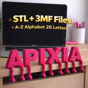 May include: Hot pink 3D-printed letters spelling out the word "APIXIA" with attached articulated legs. The letters are displayed on a wooden surface in front of a laptop. The laptop screen displays the text "STL + 3MF Files" and "A-Z Alphabet 26 Letters".