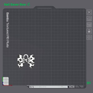 May include: A digital interface display showing a 3D model of a bow with a black and white cow print pattern. The screen includes text labels reading Nail Saver Bow and Bambu Textured PEI Plate, set against a dark gray grid background.