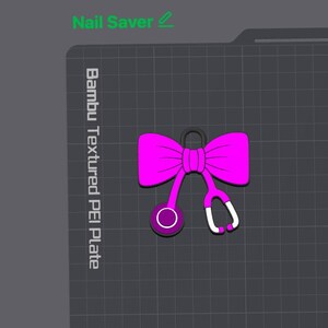 May include: A bright pink bow icon with a stethoscope attachment, featuring a dark purple chest piece and white earpieces. The design is displayed on a dark gray grid background with the text Nail Saver and Bambu Textured PEI Plate.