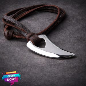 May include: A set of three ceramic mugs with a speckled, matte finish. The mugs are in shades of cream, light gray, and dark gray. Each mug has a simple, minimalist design, perfect for coffee or tea.